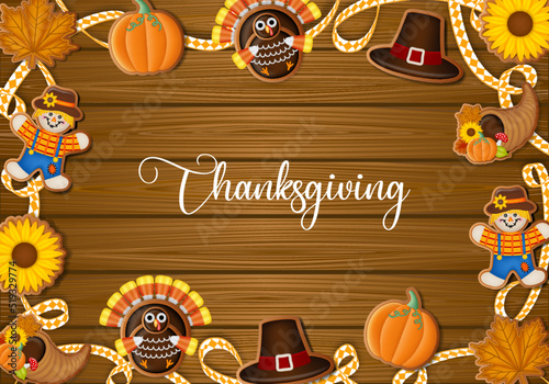 Thanksgiving poster with gingerbread cookies and ribbon on wooden background