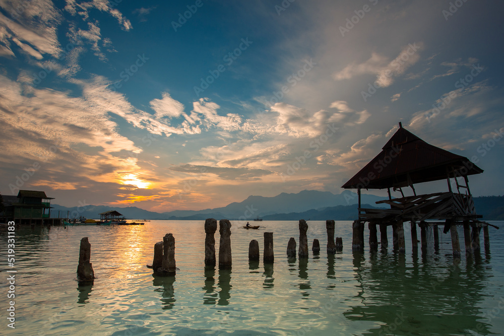 stunning sunset on the beach Tanjung Putus Lampung. building on a clear sea under a sunset. Indonesian landscapes tropical beaches stunning sunset on the beach Tanjung Putus Lampung. building on a clear sea under a sunset. Indonesian landscapes tropical beaches