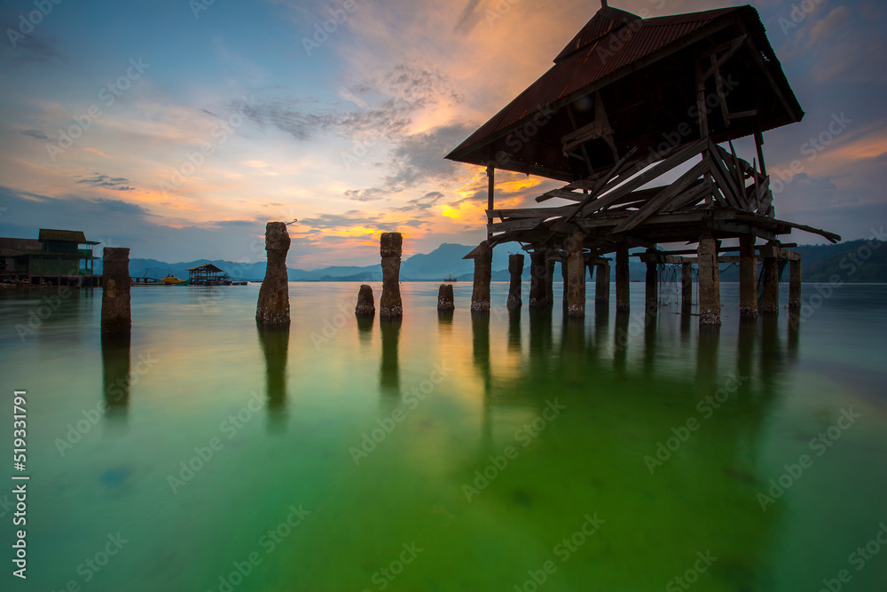 stunning sunset on the beach Tanjung Putus Lampung. building on a clear sea under a sunset. Indonesian landscapes tropical beaches stunning sunset on the beach Tanjung Putus Lampung. building on a clear sea under a sunset. Indonesian landscapes tropical beaches