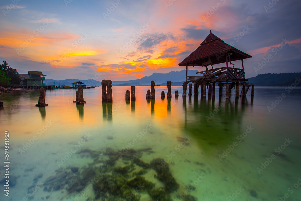 stunning sunset on the beach Tanjung Putus Lampung. building on a clear sea under a sunset. Indonesian landscapes tropical beaches. stunning sunset on the beach Tanjung Putus Lampung. building on a clear sea under a sunset. Indonesian landscapes tropical beaches.