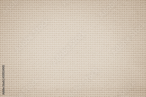 Fabric canvas woven texture pattern background in light beige cream brown color
