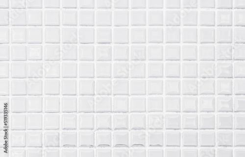 White or gray ceramic wall tiles background. Design geometric mosaic texture.
