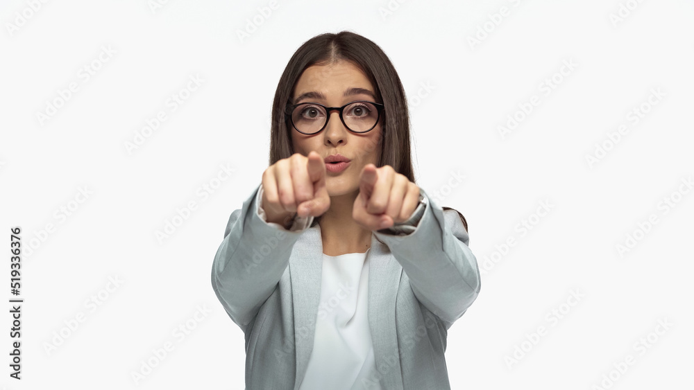 businesswoman in grey blazer and eyeglasses pointing with fingers isolated on white.