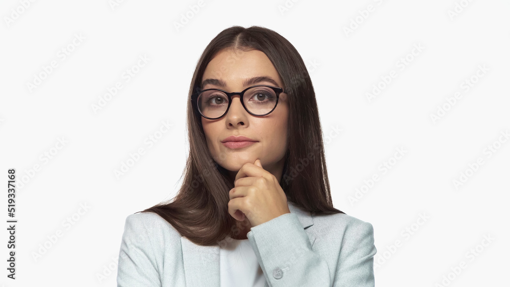 pretty young businesswoman in grey blazer and eyeglasses looking at camera isolated on white. pretty young businesswoman in grey blazer and eyeglasses looking at camera isolated on white.