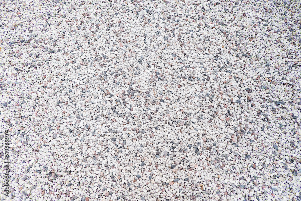 Mixed small gray broken rocks, loose gravel, road construction. Limestone aggregate. Crushed stone background Mixed small gray broken rocks, loose gravel, road construction. Limestone aggregate. Crushed stone background