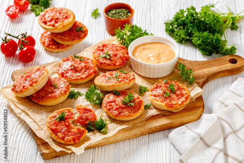 mini pizzas with ham and pecorino cheese  top view