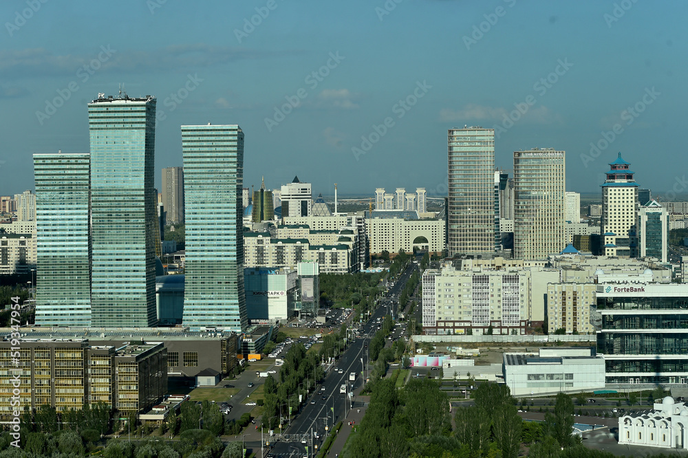 Obraz premium Top view of cityscape of Astana, the capital of Kazakhstan, with modern skyscrapers,park and wide roads.