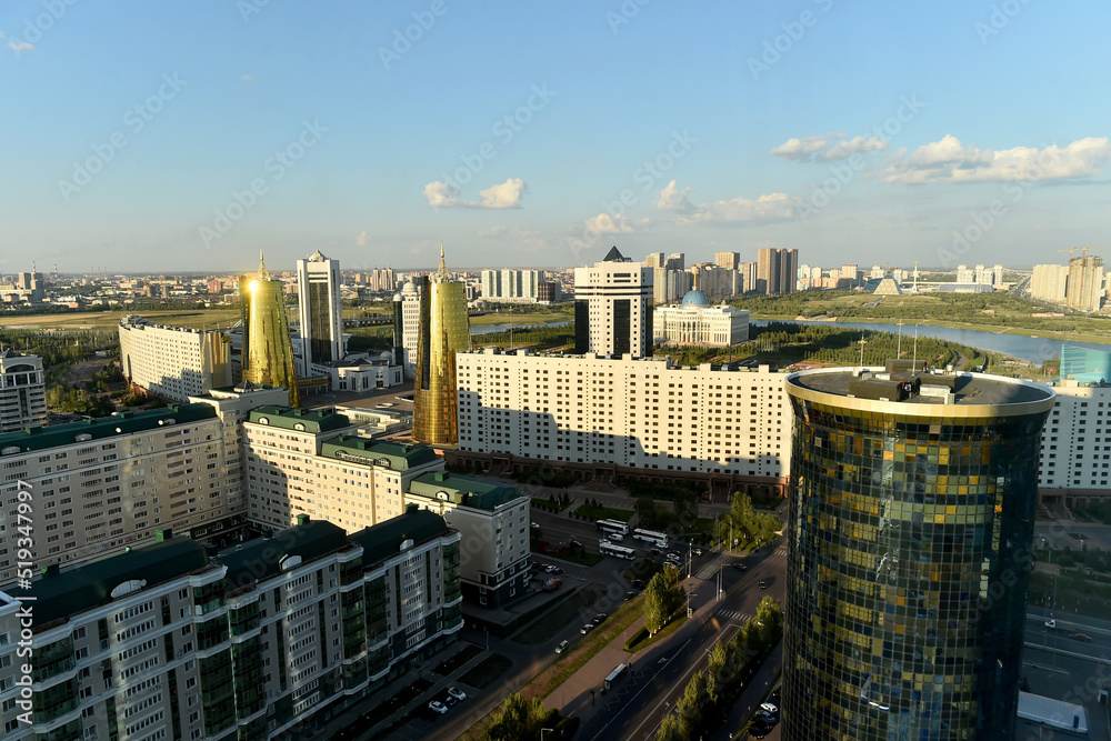 Fototapeta premium Top view of cityscape of Astana, the capital of Kazakhstan, with modern skyscrapers,park and the presidential palace, Ak Orda in background.
