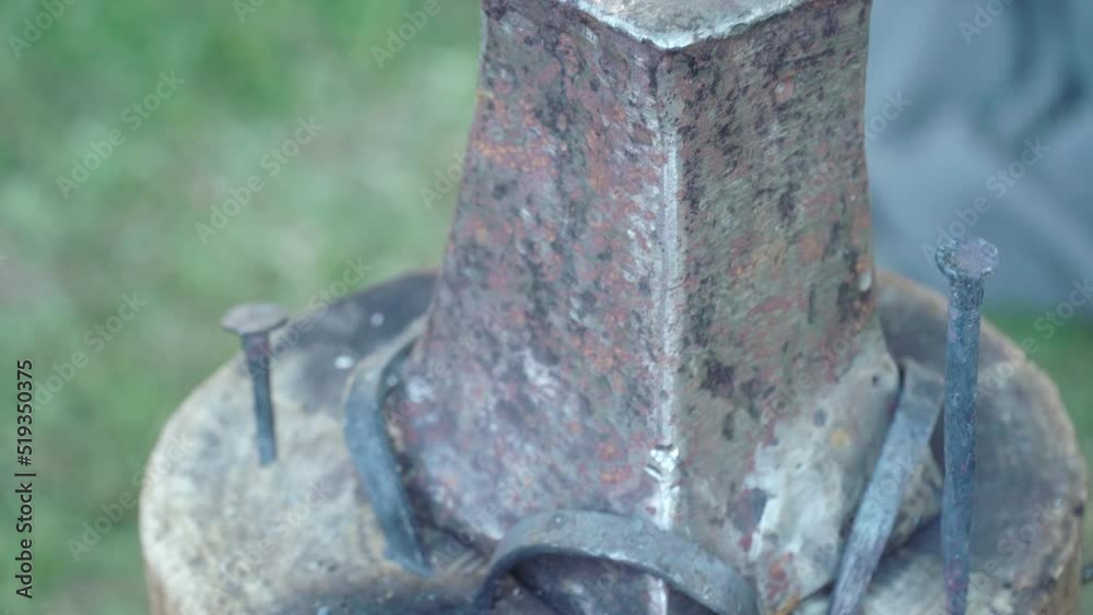 Portable anvil on a log with blacksmith tools from the time of the Roman Empire Portable anvil on a log with blacksmith tools from the time of the Roman Empire