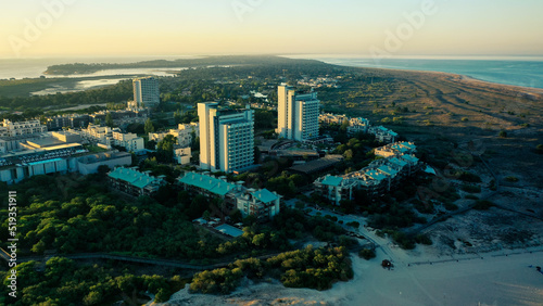 Aerial Bird's eye view of Troia Peninsula on a sunny day, near Lisbon. Sado river in the background