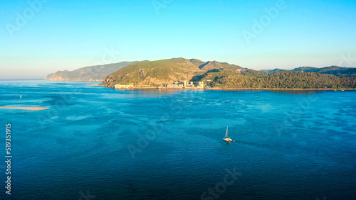 Aerial wide shot showing luxury landscape of Arrabida National Park surrounded by coral reef and turquoise water in Portugal. View from troia peninsula.