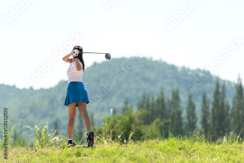 Golfer sport course golf ball fairway. People lifestyle woman playing game golf tee of mountain background. Asia female player game shot in summer. Healthy and Sport outdoor