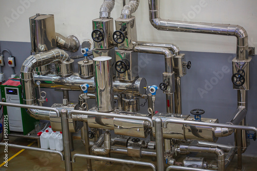 Stainless pipes with valve pressure meter in equipment tank