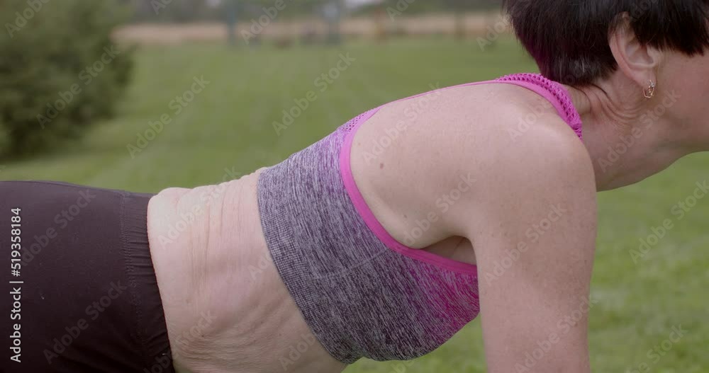 Sporty 60 y.o. mature woman beginning of solo outdoor yoga classes at older age. Back muscle training. 14.07.2022 CZ, Kladno, Armenska vídeo do Stock | Adobe Stock