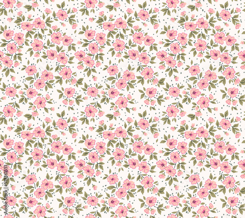 Vector seamless pattern. Pretty pattern in small flowers. Small pink flowers. White background. Ditsy floral background. The vintage template for fashion prints. Stock vector. © ann_and_pen