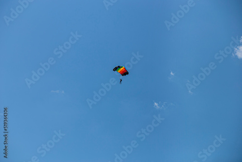 Wallpaper Mural Parasailing in blue sky. Parachute sports, active leisure, travel, vacation concept. Freedom and active lifestyle Torontodigital.ca