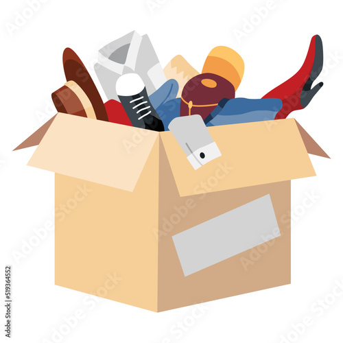 Cardboard donation box full of clothing. Charity and donate for poor people, help homeless and support needy. Volunteering, social care charity concept. Needed items