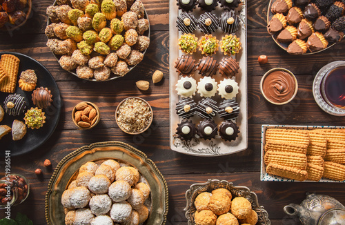 Arabic Cuisine; Cookies for celebration of El-Fitr Islamic Feast.(The Feast that comes after Ramadan). Varieties of Eid Al-Fitr sweets (kahk,biscuits, petit four). Top view with close up.