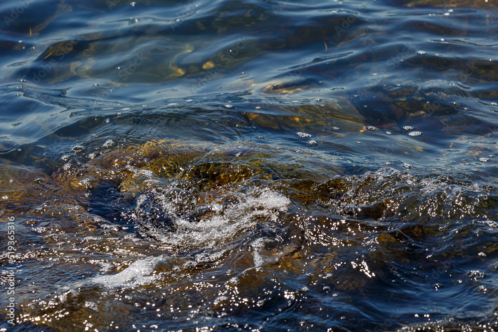 Waves hit a rock in the sea Waves hit a rock in the sea