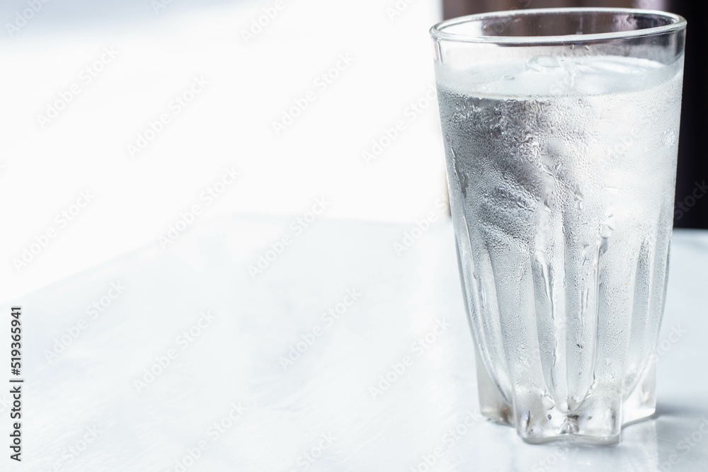 Water glass with some ice selective focus, blur some part. Water glass with some ice selective focus, blur some part.