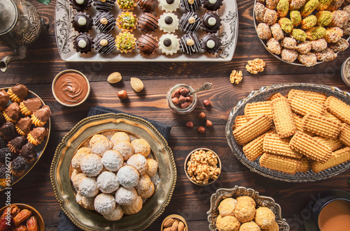 Arabic Cuisine; Cookies for celebration of El-Fitr Islamic Feast.(The Feast that comes after Ramadan). Varieties of Eid Al-Fitr sweets (kahk,biscuits, petit four). Top view with close up.