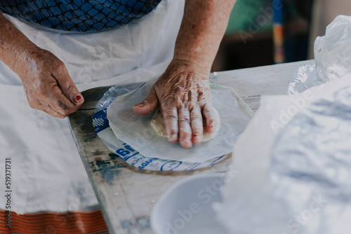 close up of a person preparing a dough