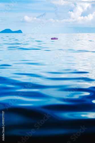 Inflatable ring floating away towards the sea