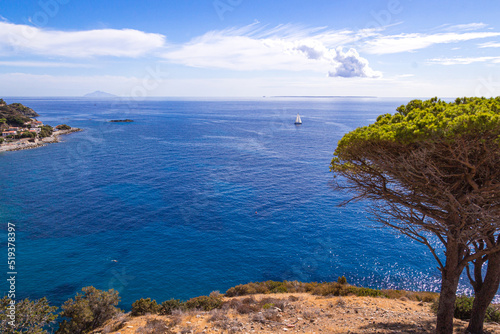 View to flat Island Pianosa and Isle of Montecristo from West Coast of Elba Island, Italy photo
