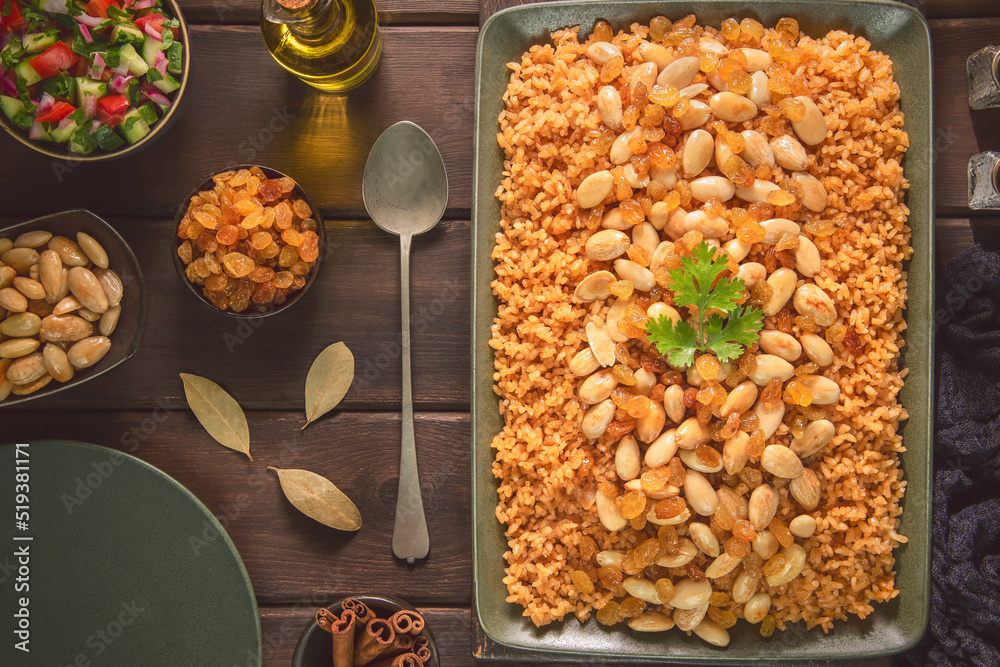 Arabic Food Egyptian Rice with crispy nuts and raisins. Top view with
