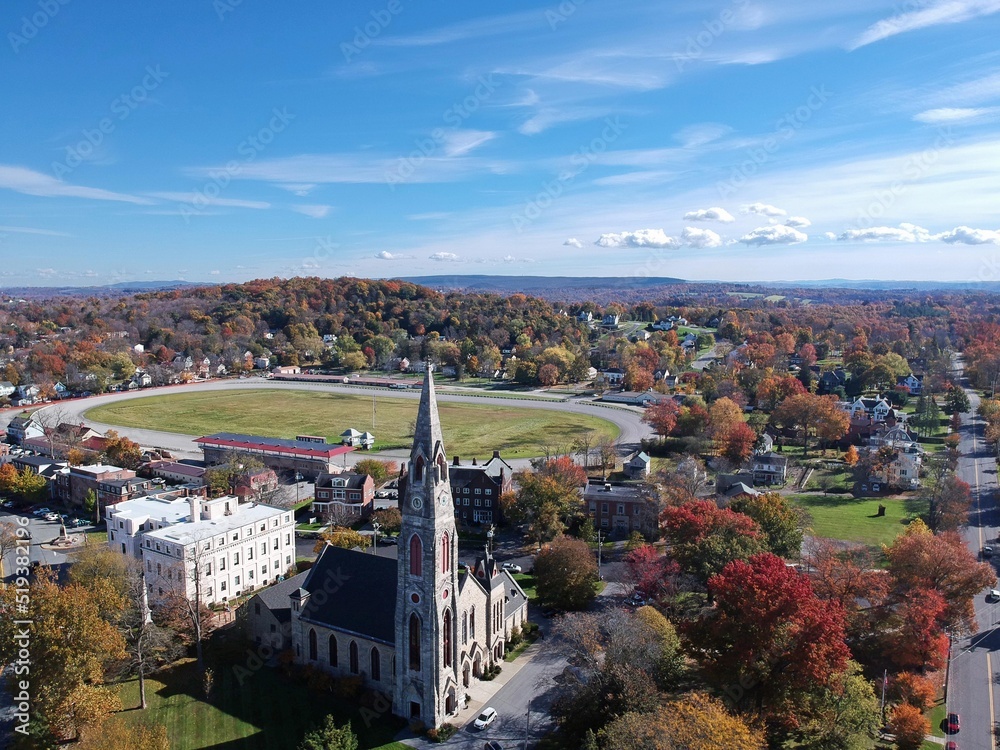 Aerial view of a church and town in autumn