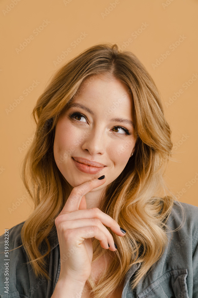 White happy woman wearing shirt smiling and looking aside White happy woman wearing shirt smiling and looking aside
