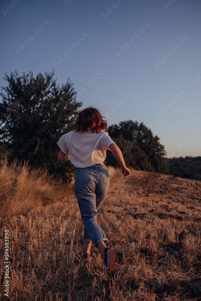 Girl looking for something in countryside Girl looking for something in countryside