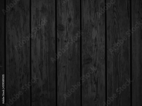 Black wooden background. Dark wallpaper