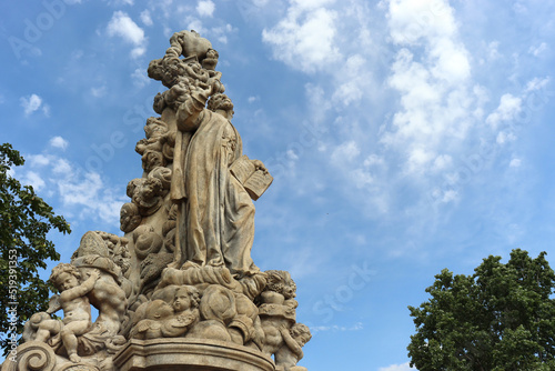 Historical religious statues on Charles Bridge in Prague - the capital city of Czech Republic.