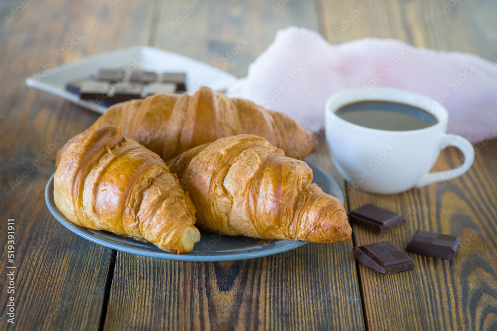 croissants with chocolate and a cup of coffee croissants with chocolate and a cup of coffee