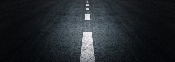 Asphalt road texture background, black tarmac surface with white marking stripes, Transport urban background, and Dark street texture detail.