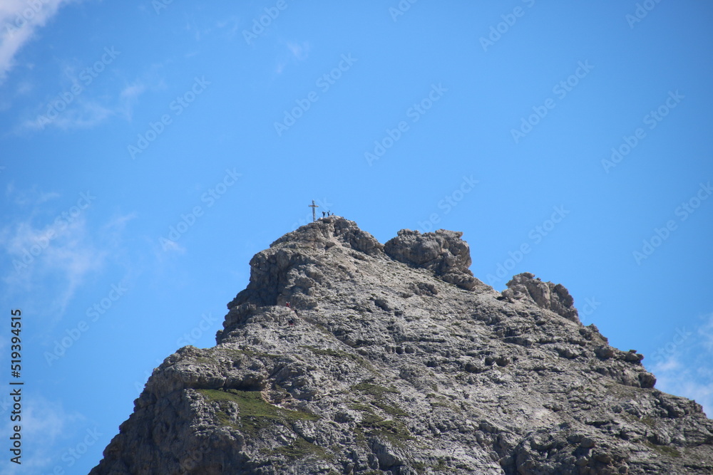 Rock formation with trees in foreground and a cloudy sky Rock formation with trees in foreground and a cloudy sky