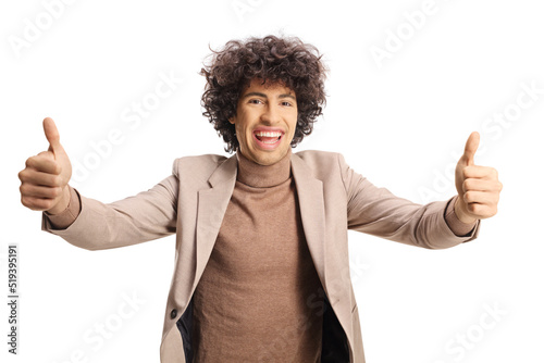 Young man with curly hair gesturing thumbs up