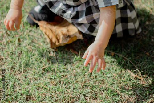 Cute baby girl hands. Aesthetic baby. Child development.