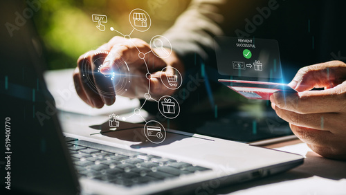 Businessman with notebook computer paying online shopping on virtual tech with credit card. Online payment banking transaction and e-commerce digital marketing technology concept. 3D illustration.