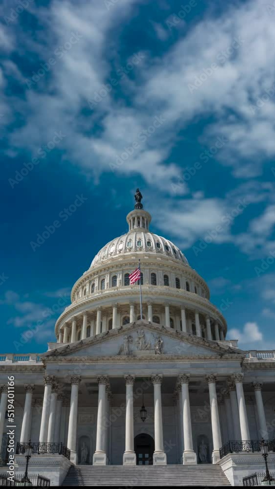Vertical video of large US Capitol with copy space in Washington, DC with time lapse of blue sky with clouds. Vertical video of large US Capitol with copy space in Washington, DC with time lapse of blue sky with clouds.