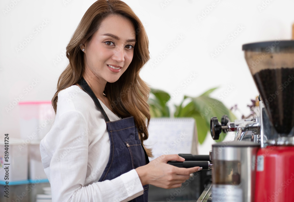 Startup successful small business owner sme beauty girl stand with tablet smartphone in coffee shop restaurant. Portrait of asian tan woman barista cafe owner. SME entrepreneur seller business concept