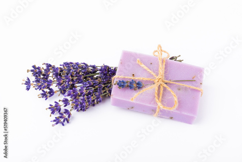 Handmade soap with lavender isolated on white background.Lavender spa. Lavender flowers and handmade soap. Natural herbal cosmetics with lavender flowers on a marble background.Copy space.Fletley