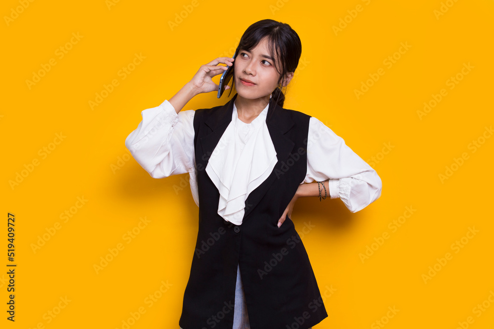 happy young asian beautiful woman using mobile phone isolated on yellow background
happy young asian beautiful woman using mobile phone isolated on yellow background
