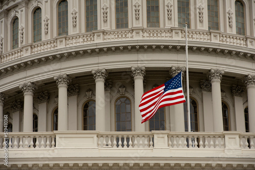 US Capitol Dome with flag at half staff