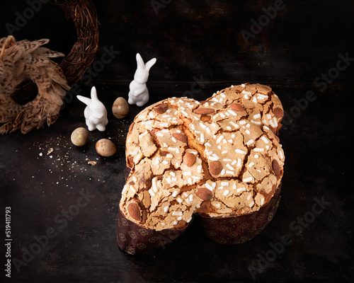 Colomba Pasquale, Italian Easter Dove Sweet Bread Colomba di Pasqua on dark surface. Selective focus, space for text. Traditional dessert in Italy.