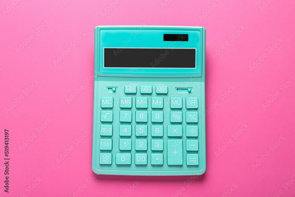 Turquoise calculator on pink background, top view Turquoise calculator on pink background, top view