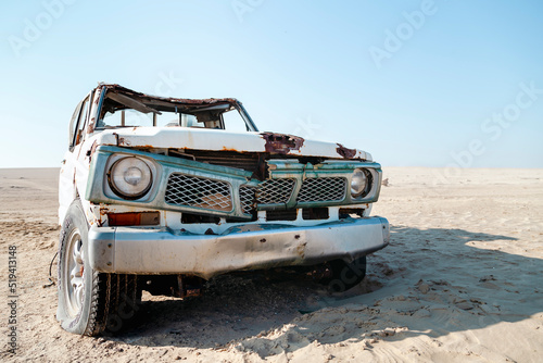 An old abandoned car in the desert in UAE