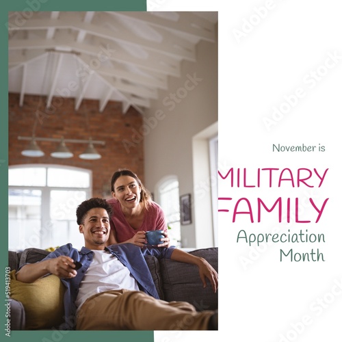 Image of military family appreciation day over happy diverse couple watching tv photo