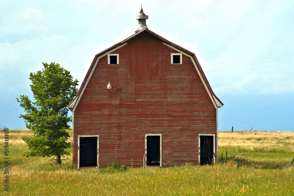 Red Barn surrounded by grass Red Barn surrounded by grass